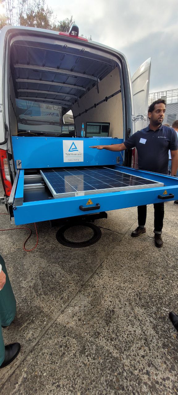 Man in front  of van with the mobile performance tests for modules 
